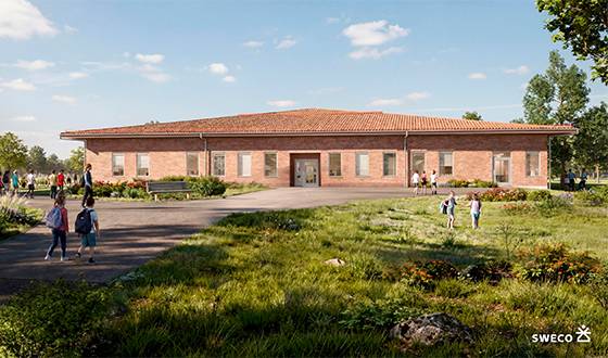 Visionsbild av hur den nya byggnaden vid Gunnarsbyskolan ska se ut, låg tegelbyggnad i grönområde